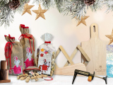 Weihnachtliche Darstellung der MBF-Produkte zu Weihnachten 2025 im Hintergrund Tannenzweige und goldene Sterne